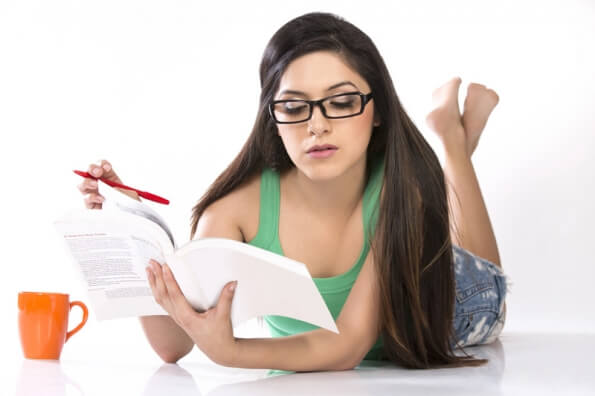 girl posing while reading book 