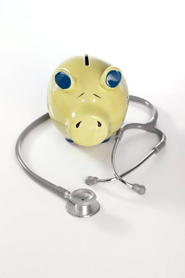 conceptual picture with piggy bank and stethoscope