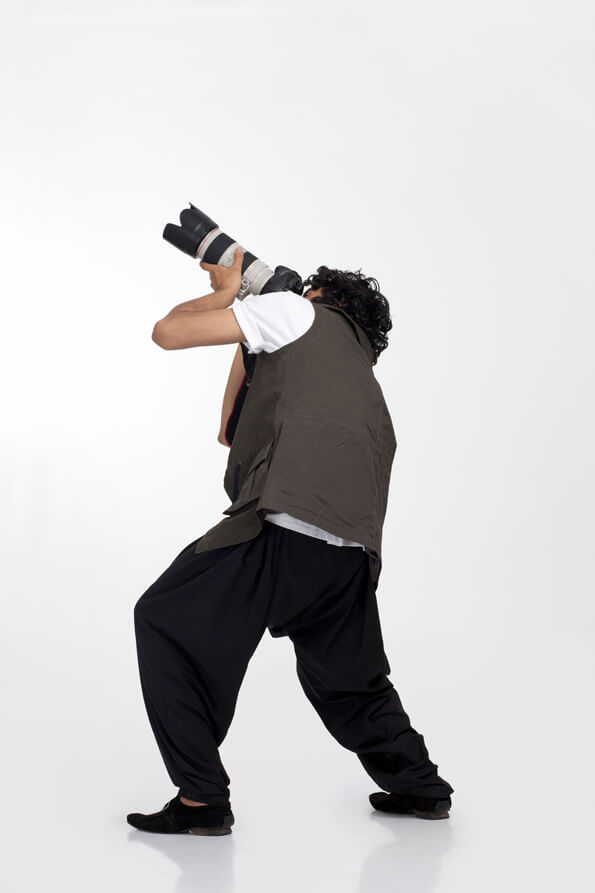 back view of a boy clicking pictures 