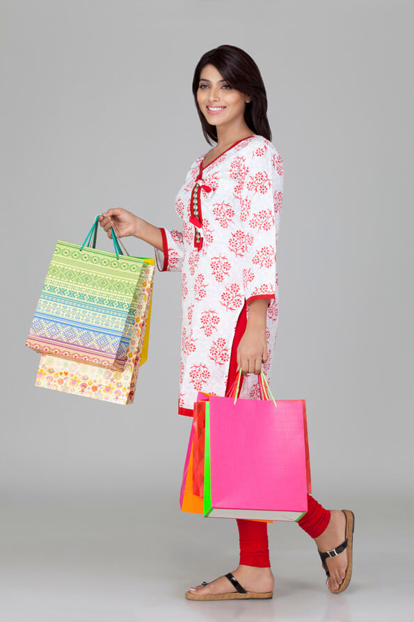 indian girl posing with shopping bags 