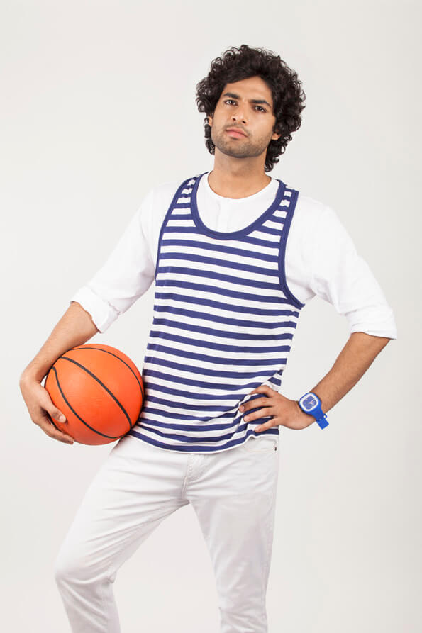college boy holding basketball