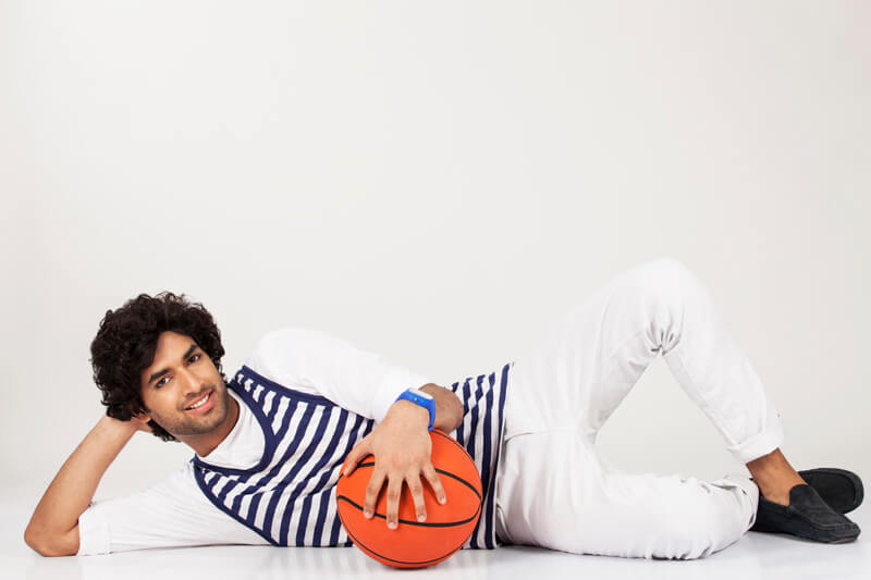 guy lying down with basketball