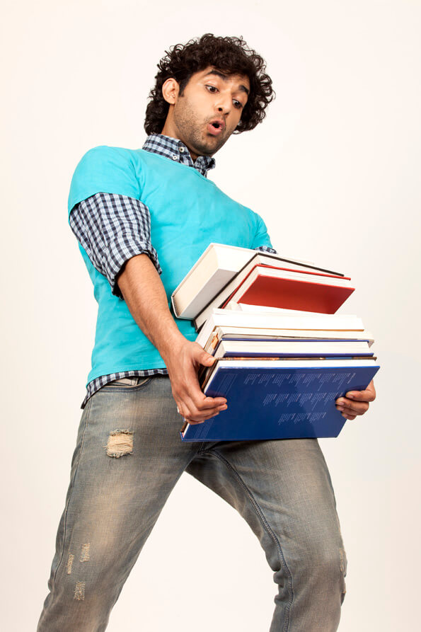 college boy carrying books
