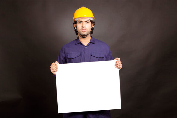 Technician miner engineer holding placard