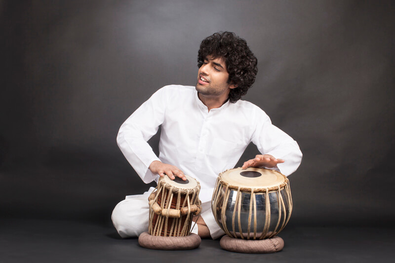 man performing with tabla