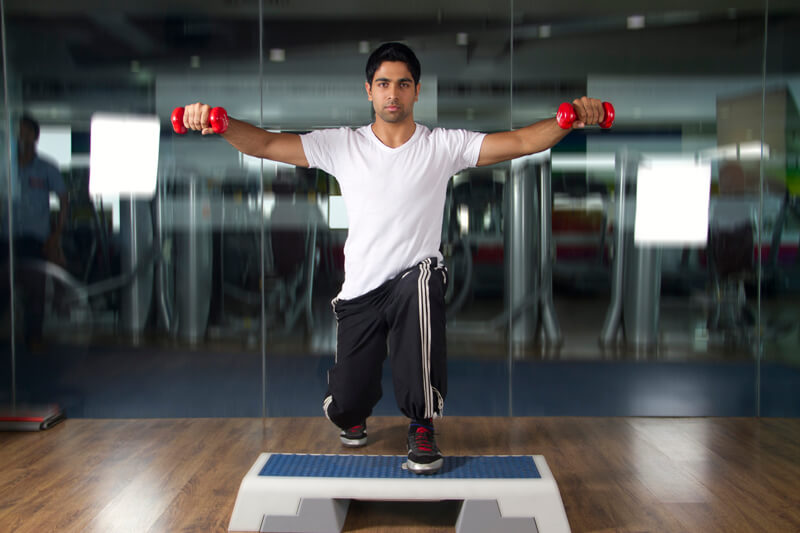 man exercising in gym 
