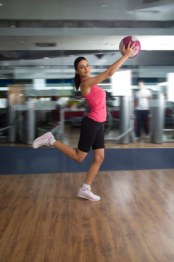 sports girl exercising with a ball