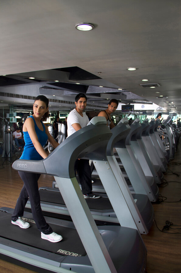 people standing on a treadmills