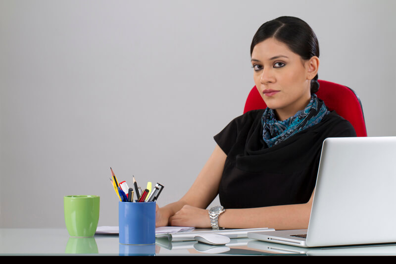 business woman posing at her desk 