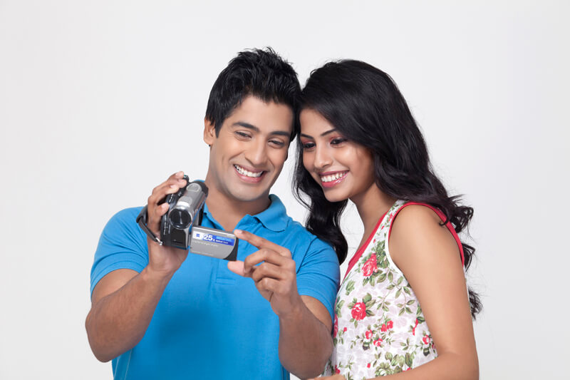 couple with video camera