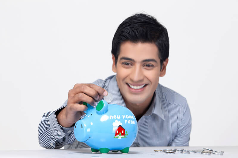 cheerful man with a piggy bank