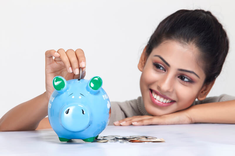 smiling lady with piggy bank