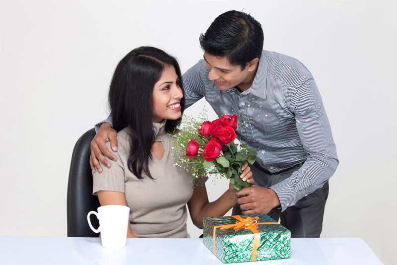 husband wishing wife with flowers