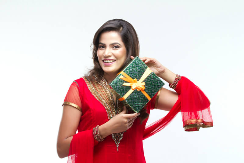 woman in ethnic wear flaunting her gift