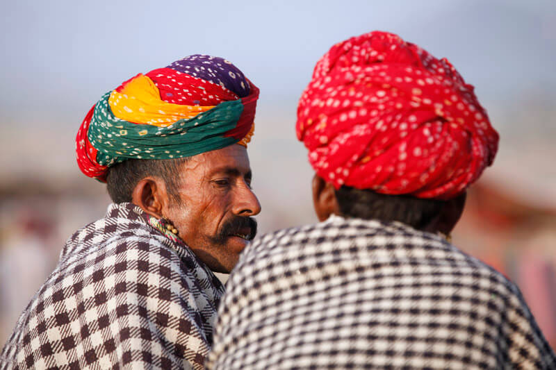 rural men wearing turban and talking 
