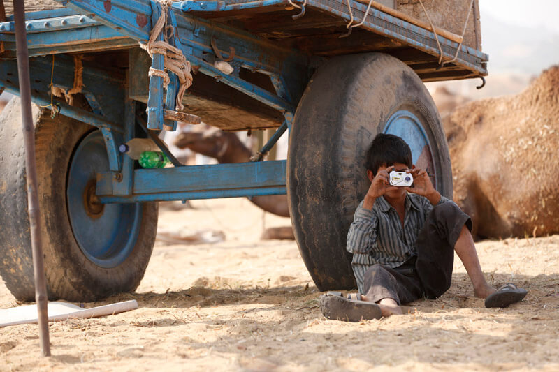 village kid with a small camera