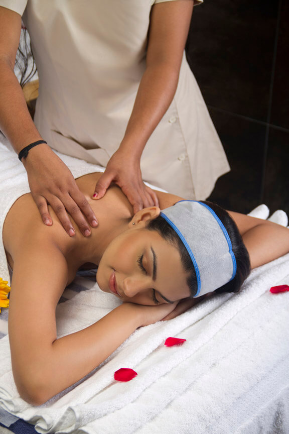 spa therapist giving massage