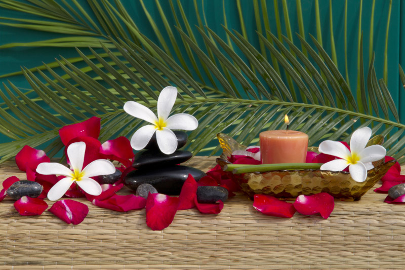 aromatic candles with flowers and spa treatment 