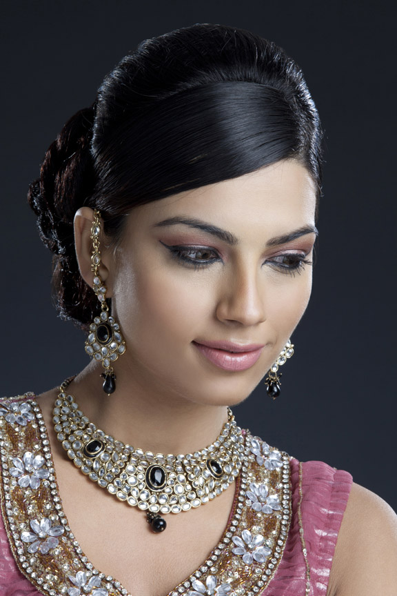 shy woman posing wearing jewellery 