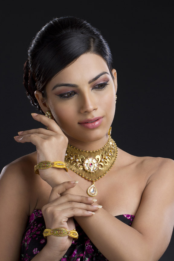 shy woman posing wearing traditional jewellery 