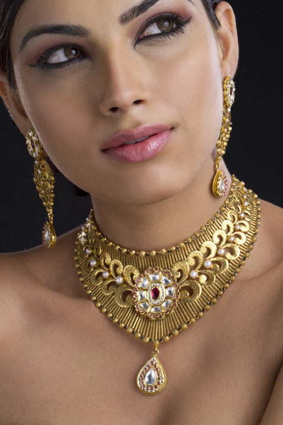 woman wearing gold jewellery 