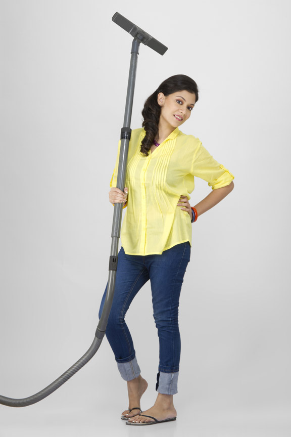 woman posing with vacuum cleaner 