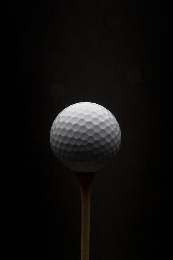 golf ball with black background 