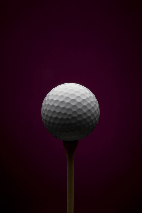 Golf ball with purple background