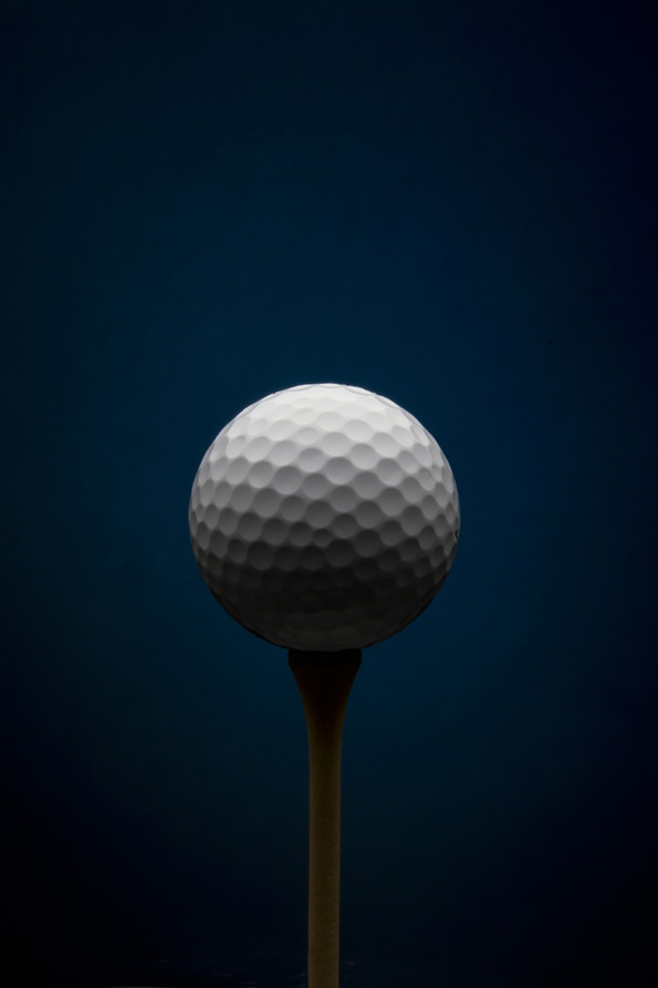 Golf ball with blue background