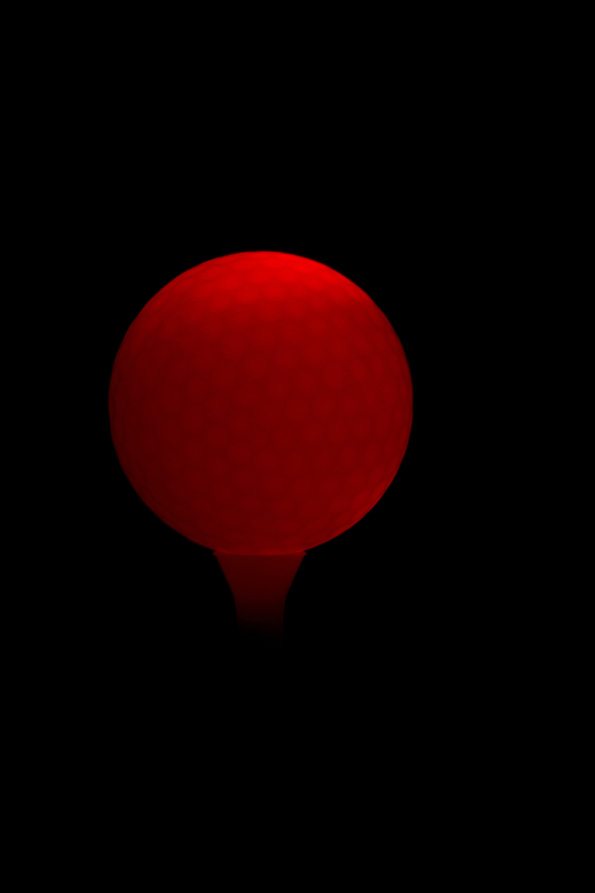 golf ball under created lights