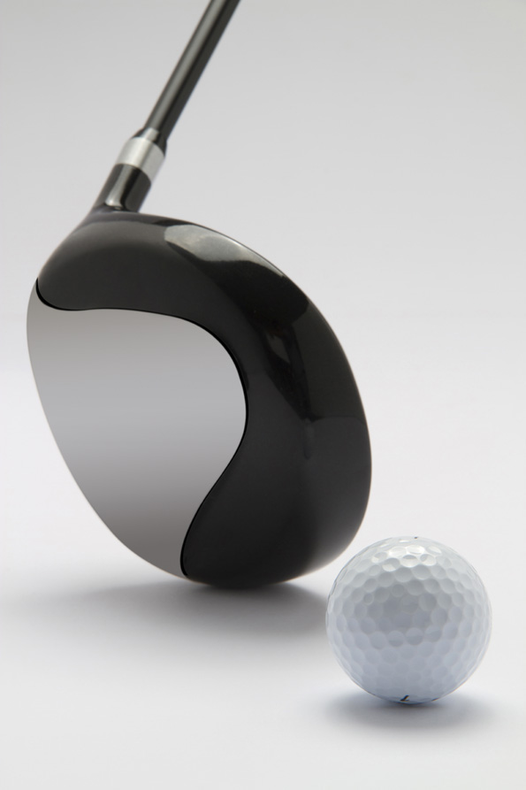 close up of golf club with golf ball