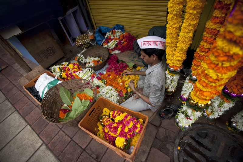 man selling flowers during ganpati festival 