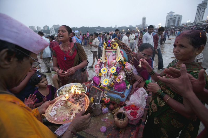 people celebrating lord ganesha festival