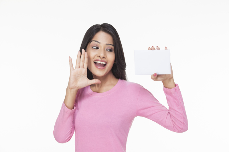 woman posing with a white card