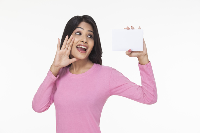 woman posing with a card