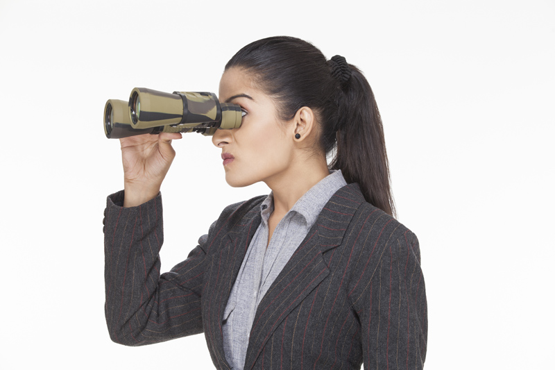 woman looked angry while looking at something through binocular 