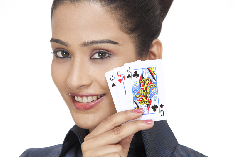 girl showing playing cards