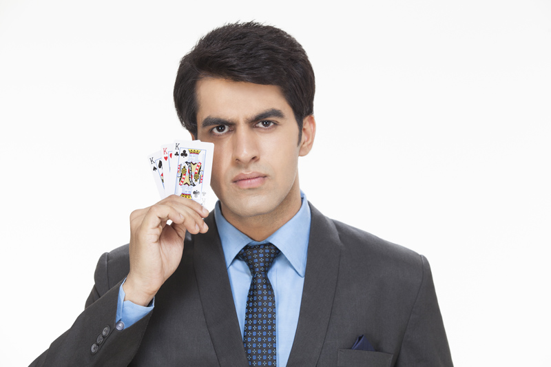 young entrepreneur posing with cards