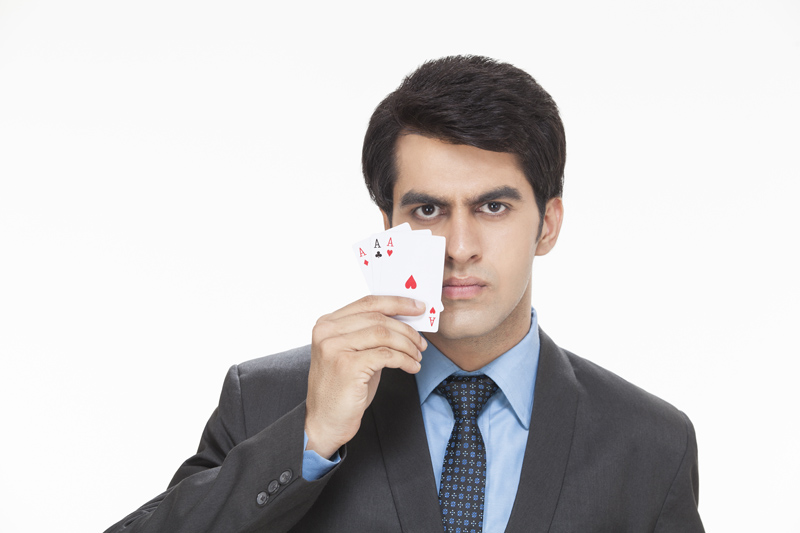 businessman showing three aces  