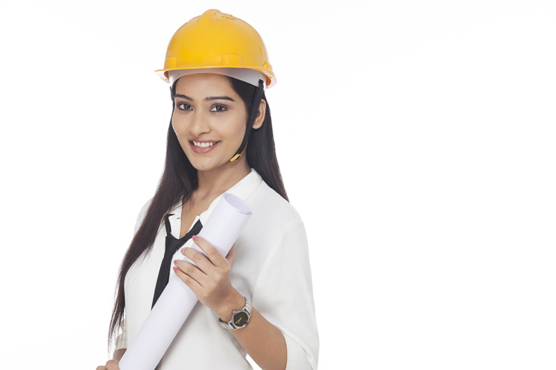 girl wearing hardhat posing with chart paper