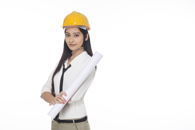 girl wearing hardhat and holding chart paper