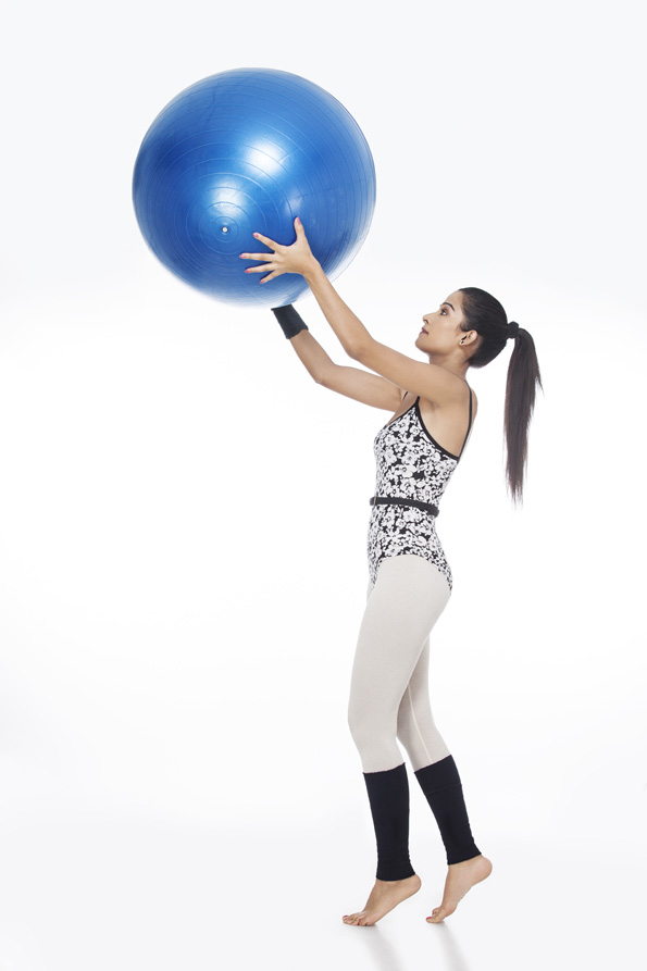 girl playing with fitness ball 