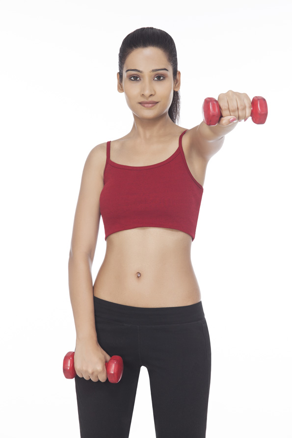 girl exercising with dumbbells