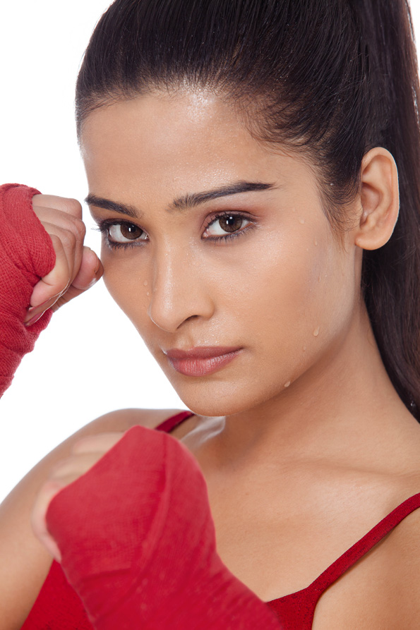 close up of girl wearing boxing gloves 