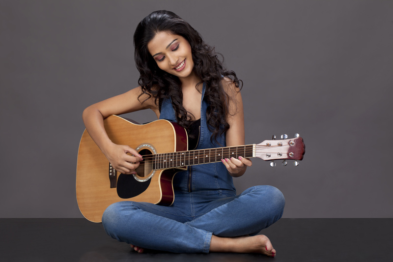 girl playing guitar   