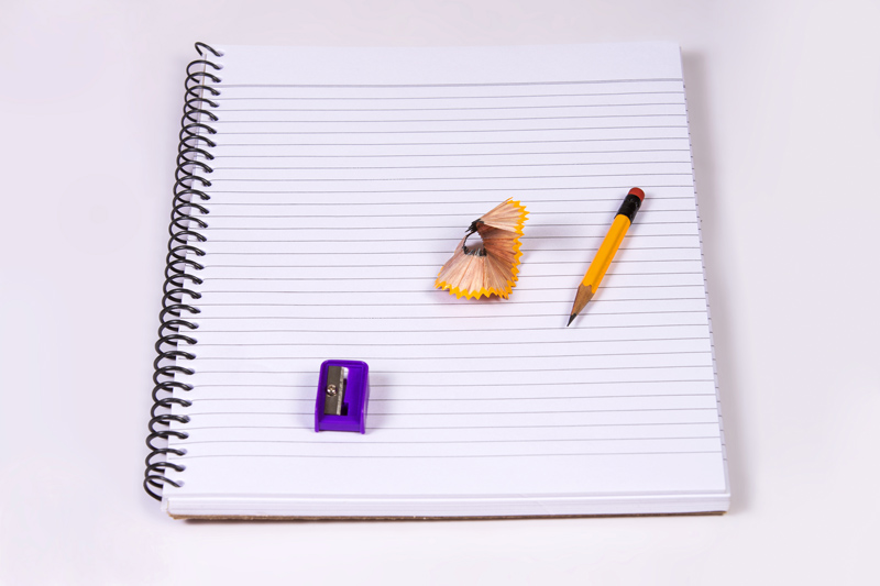 notebook with pencil and sharpener 