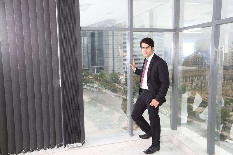 man in formals standing outside office