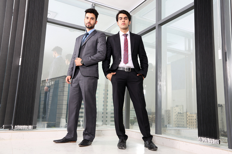 men in formal attire standing 