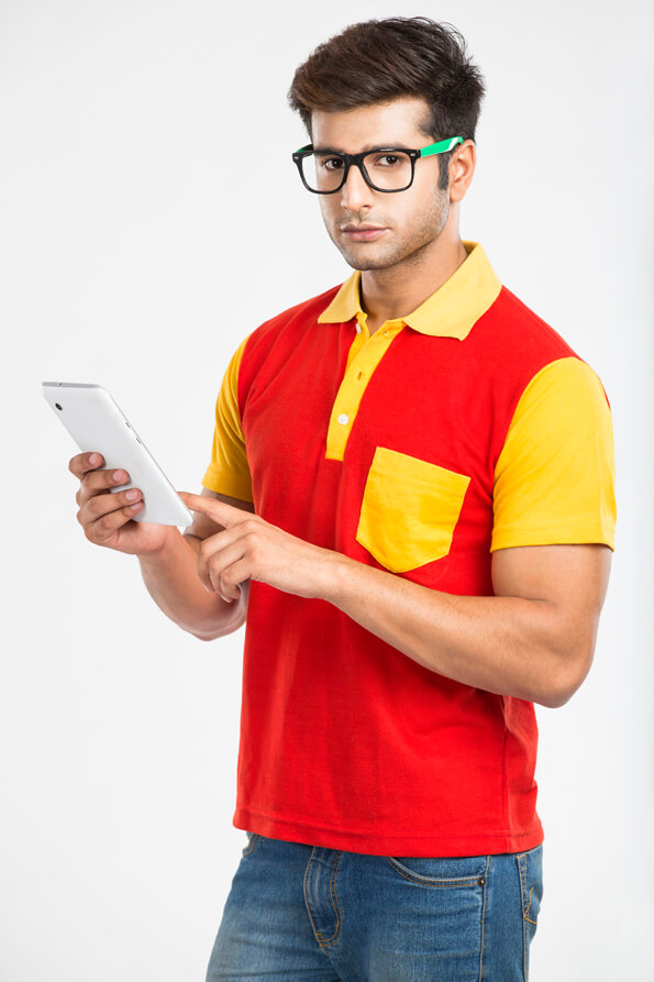 college boy with tablet and looking at the camera 