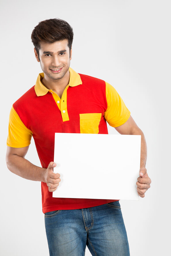 man posing with placard and smiling 